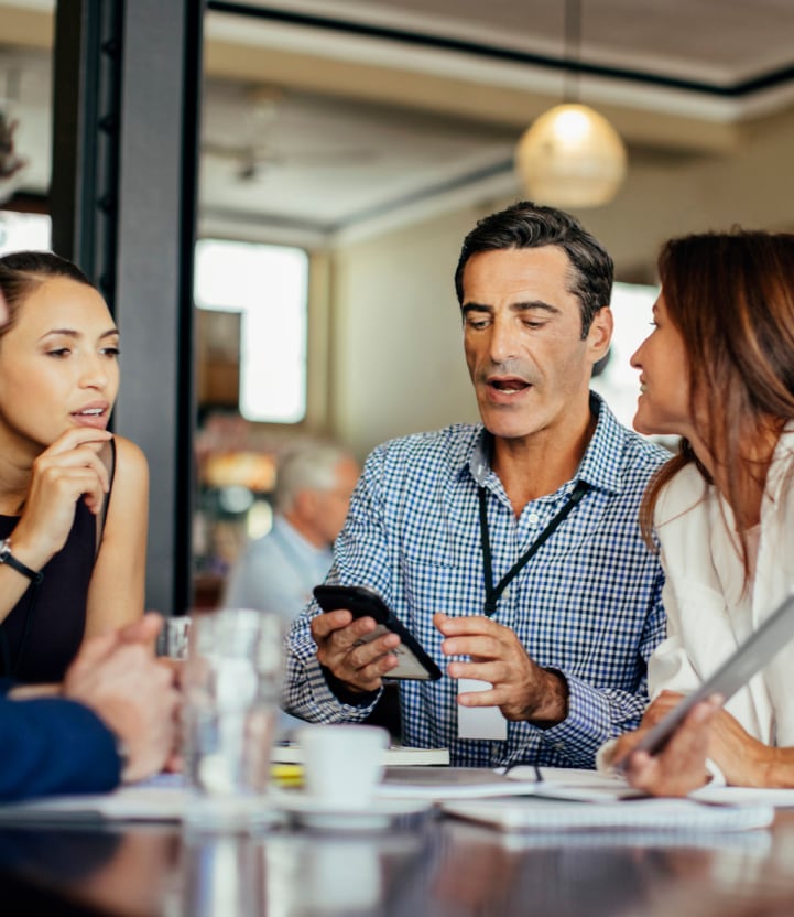 Investors discussing opportunities around a table